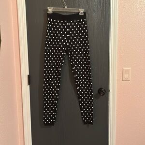 Black and white polk a dot pants, tight fitting knit material